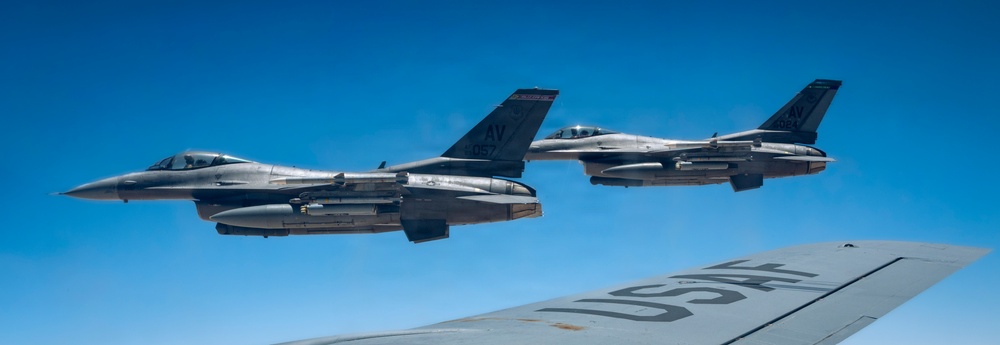 KC-135 Stratotanker refuels F-16 Fighting Falcon during security operations