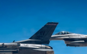 KC-135 Stratotanker refuels F-16 Fighting Falcon during security operations