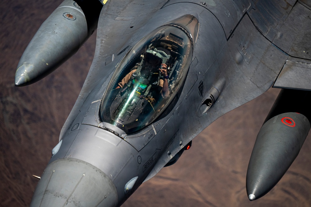 KC-135 Stratotanker refuels F-16 Fighting Falcon during security operations