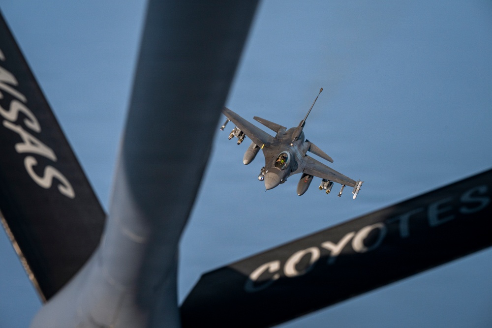 KC-135 Stratotanker refuels F-16 Fighting Falcon during security operations