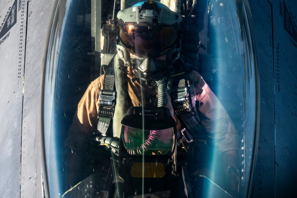 KC-135 Stratotanker refuels F-16 Fighting Falcon during security operations
