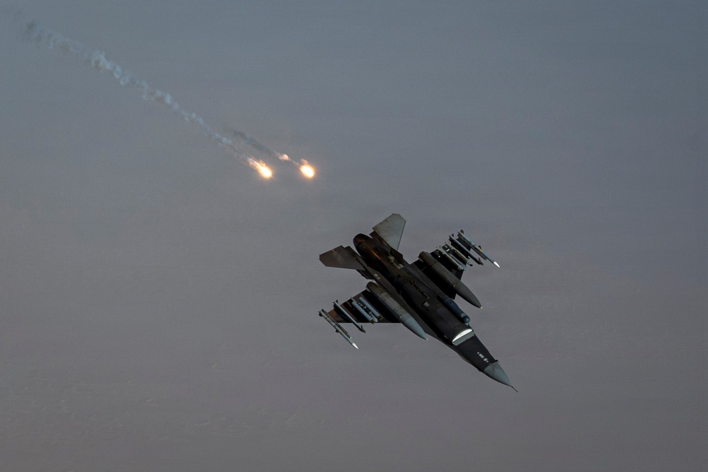 KC-135 Stratotanker refuels F-16 Fighting Falcon during security operations