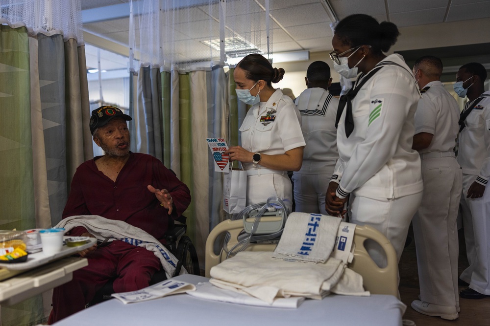 Service Members visit veterans at VA Hospital
