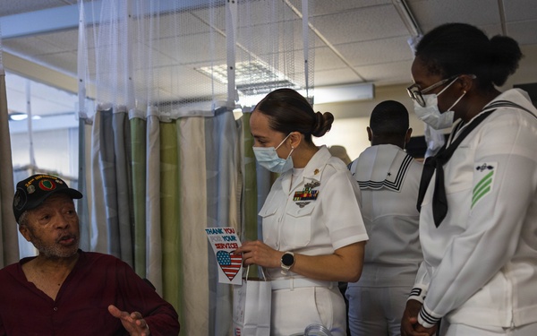 Service Members visit veterans at VA Hospital