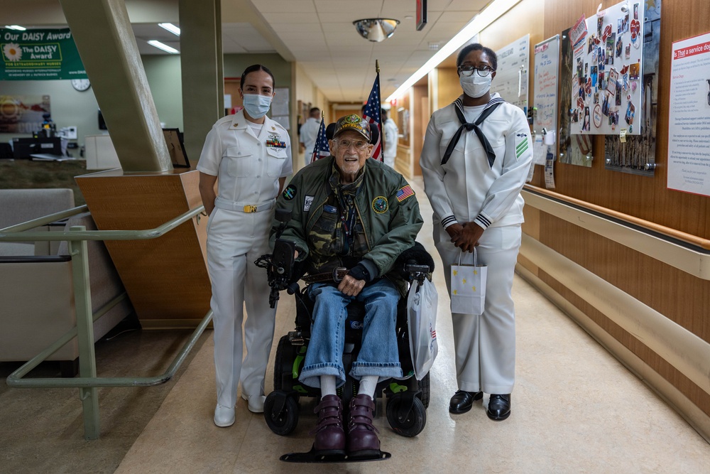Service Members visit veterans at VA Hospital