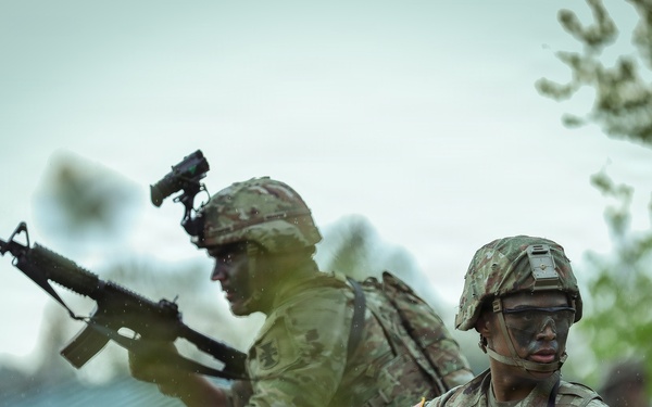 U.S. Army Reserve Soldiers React to Enemy Fire during the Best Squad Competition