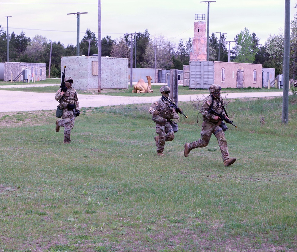 79th Theater Sustainment Command (TSC) Best Squad Competitors Simulate Assaulting a Hostile Village
