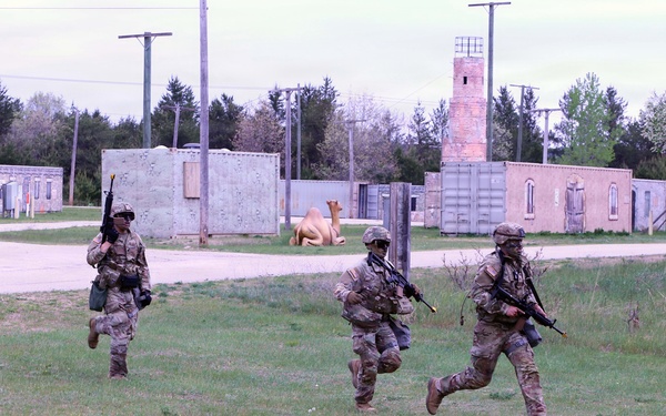 79th Theater Sustainment Command (TSC) Best Squad Competitors Simulate Assaulting a Hostile Village