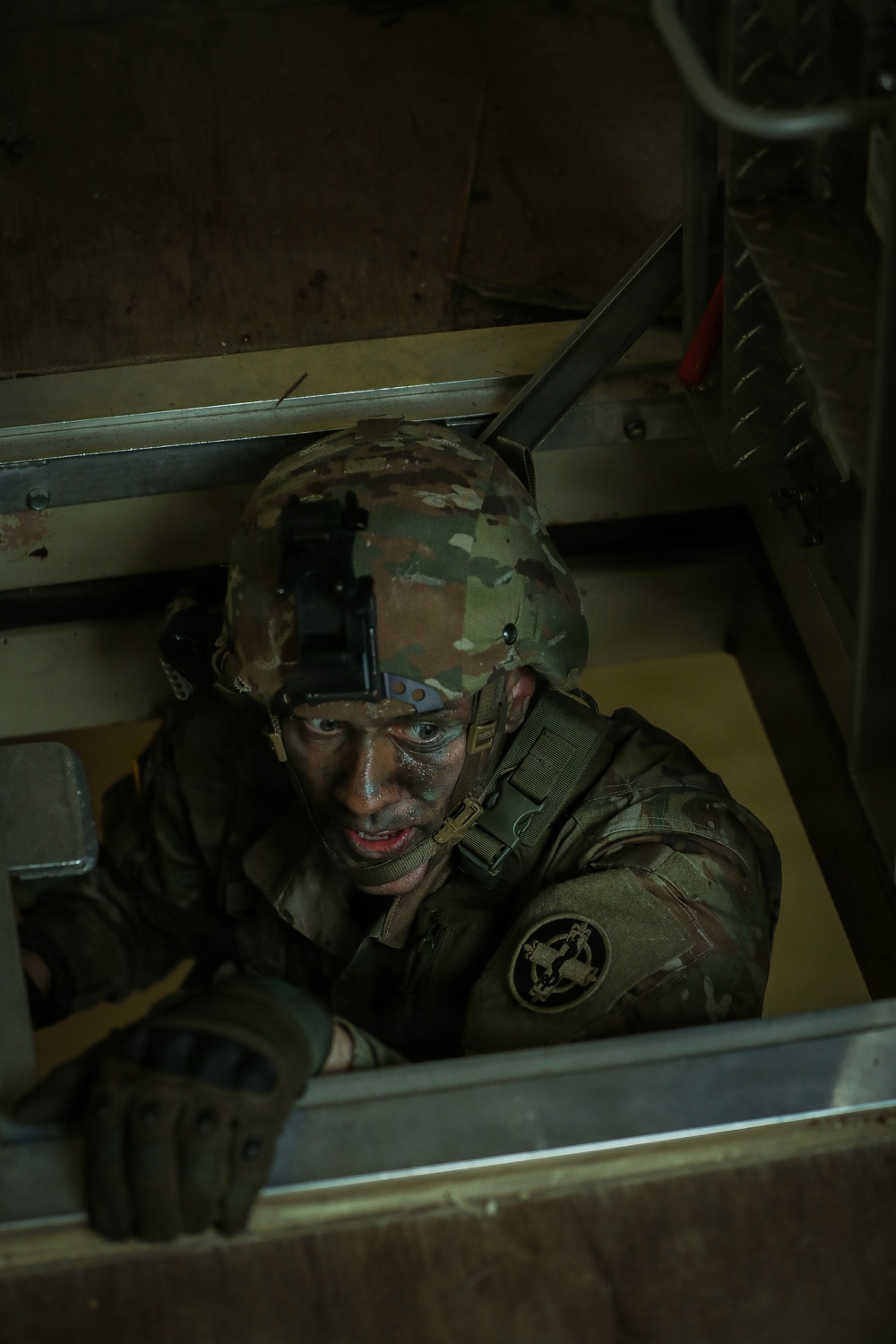 U.S. Army Reserve Soldier Enters a Seized Enemy Building during the Best Squad Competition
