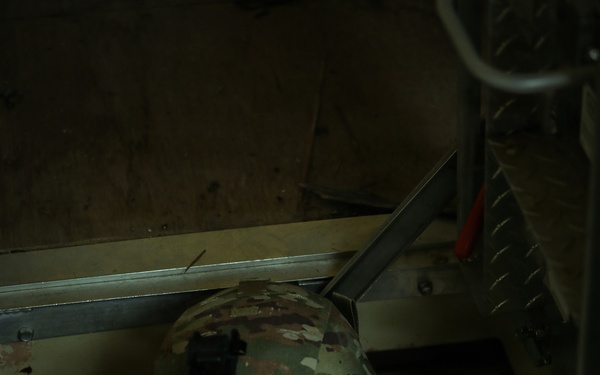 U.S. Army Reserve Soldier Enters a Seized Enemy Building during the Best Squad Competition