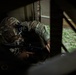 U.S. Army Reserve Soldier Provides Security for his Squad in a Seized Enemy Building during the Best Squad Competition