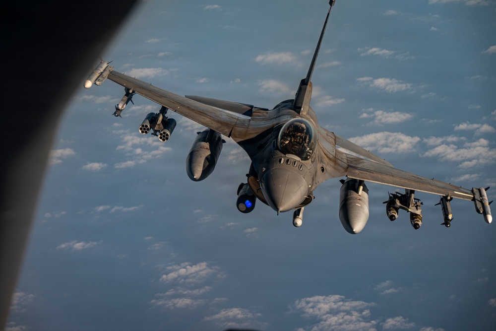 KC-135 Stratotanker refuels F-16 Fighting Falcon during security operations