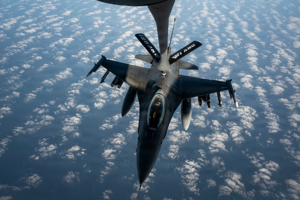 KC-135 Stratotanker refuels F-16 Fighting Falcon during security operations