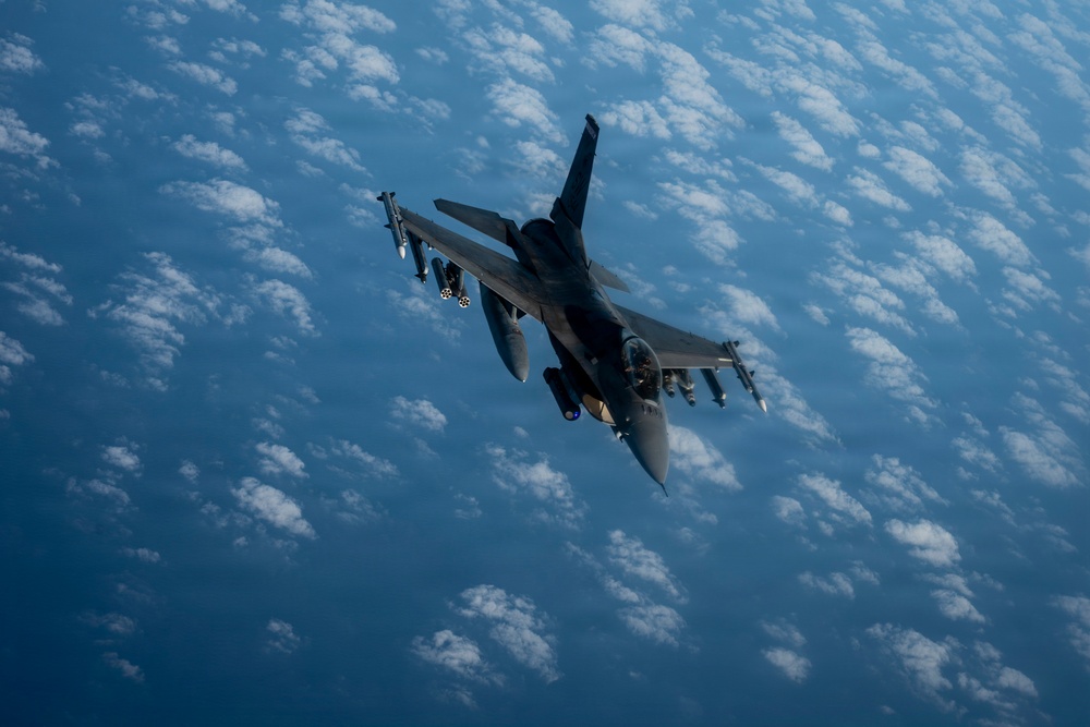 KC-135 Stratotanker refuels F-16 Fighting Falcon during security operations