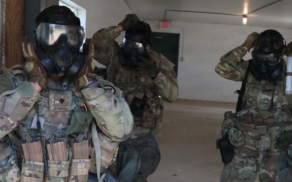 2026 U.S. Army Reserve Best Squad competitors, representing the 9th Mission Support Command, don their gas mask