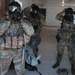 2026 U.S. Army Reserve Best Squad competitors, representing the 9th Mission Support Command, don their gas mask