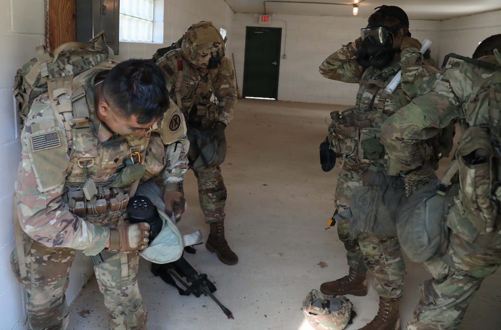 2026 U.S. Army Reserve Best Squad competitors, from the 9th Mission Support Command, don their mask after smelling gas