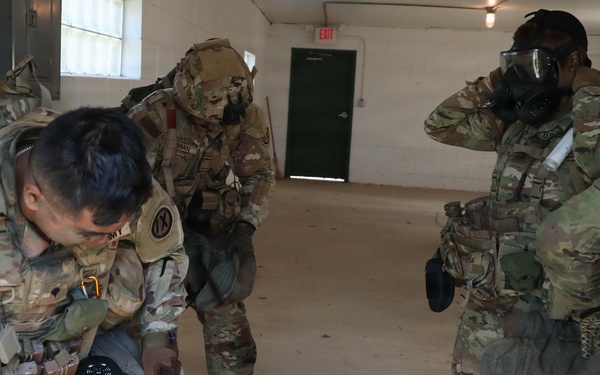 2026 U.S. Army Reserve Best Squad competitors, from the 9th Mission Support Command, don their mask after smelling gas