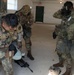 2026 U.S. Army Reserve Best Squad competitors, from the 9th Mission Support Command, don their mask after smelling gas
