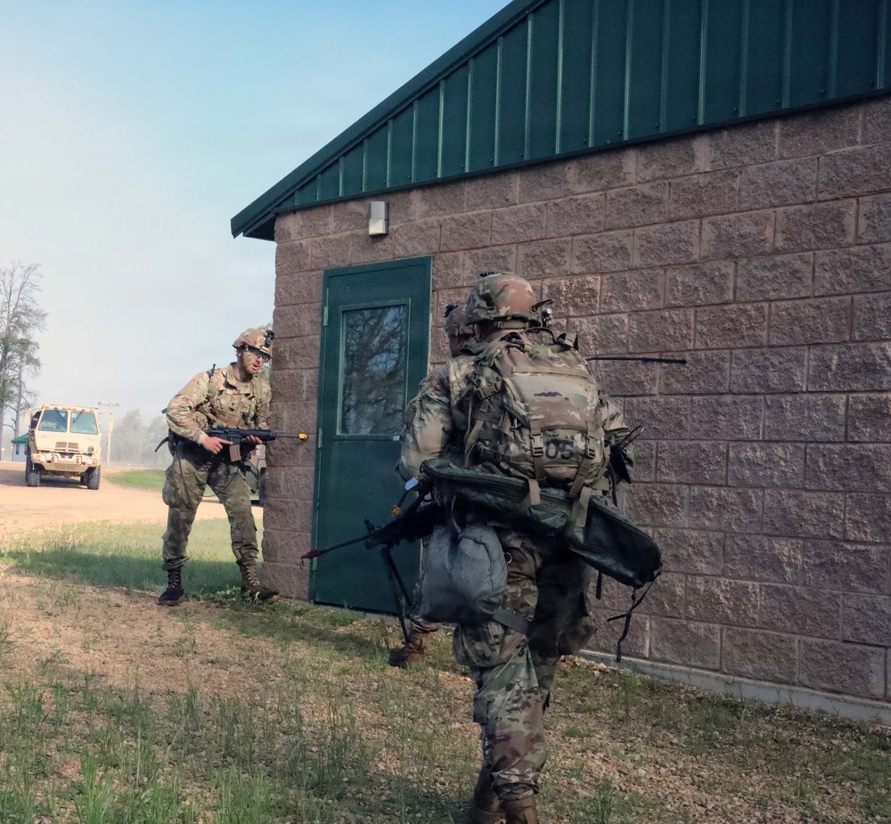 2026 U.S. Army Reserve Best Squad Competition competitors, from the 3rd Theater Medical Command (TMC) prepare to inspect a simulated hostile room