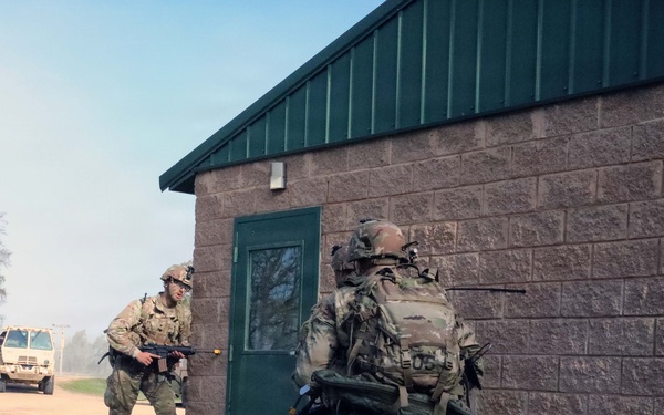 2026 U.S. Army Reserve Best Squad Competition competitors, from the 3rd Theater Medical Command (TMC) prepare to inspect a simulated hostile room