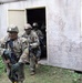 Army Reserve Best Squad competitors, from the 83rd Readiness Training Center, simulate assaulting a hostile village