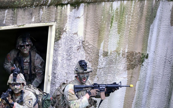 2026 U.S. Army Reserve Best Squad Competition from the 416th Theater Engineer Command, simulate assaulting a hostile village