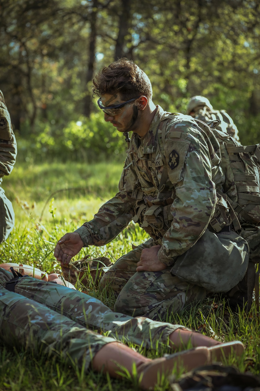 U.S. Army Soldier Renders Aid to a Casualty during the Best Squad Competition