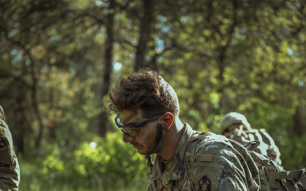 U.S. Army Soldier Renders Aid to a Casualty during the Best Squad Competition