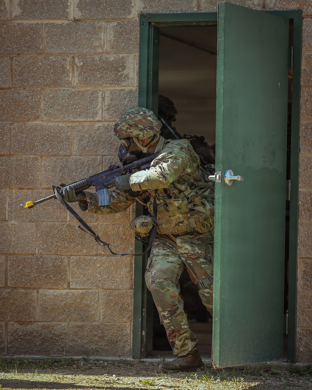 U.S. Army Soldier Leads the Way through a CBRN training during the Best Squad Competition