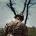 U.S. Army Soldier Equips Himself with his Weapon for Squad Movement during the Best Squad Competition