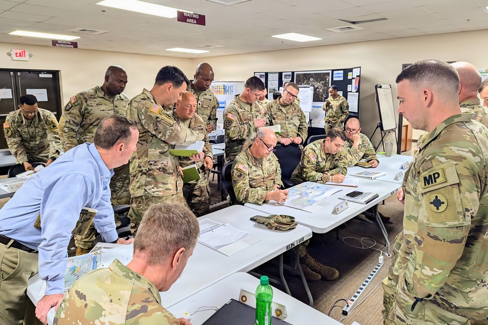 Retired U.S. Army Maj. Gen. Kurt Ryan works with the Senior Leadership of the 184th ESC during Annual Training