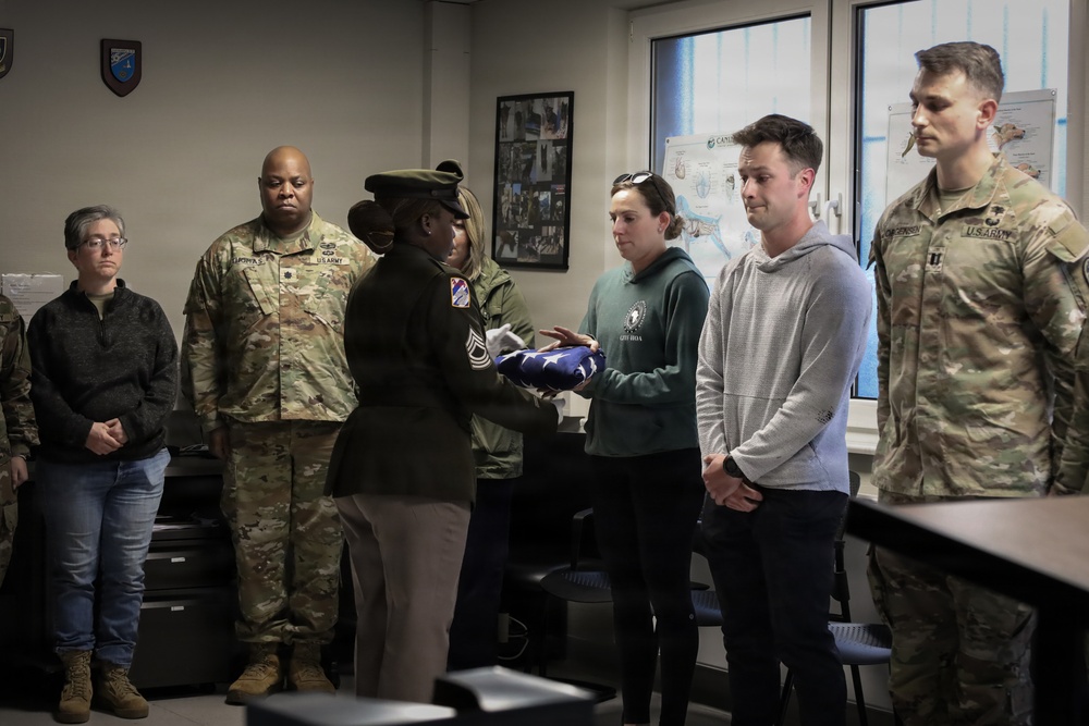 Honor Guard Presents Folded Flag to Adopter of Retired MWD Perle X429