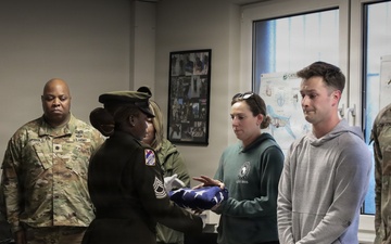 Honor Guard Presents Folded Flag to Adopter of Retired MWD Perle X429