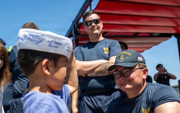 Sailors from USS Howard (DDG 83) participate in a tug-of-war competition during the 87th annual Black Ship Festival in Shimoda, Japan
