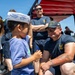 Sailors from USS Howard (DDG 83) participate in a tug-of-war competition during the 87th annual Black Ship Festival in Shimoda, Japan