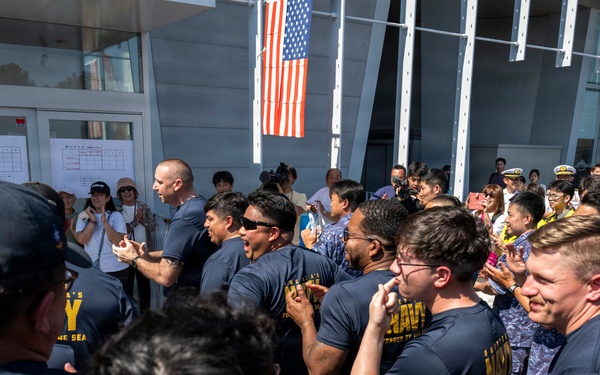 Sailors from USS Howard (DDG 83) participate in a tug-of-war competition during the 87th annual Black Ship Festival in Shimoda, Japan