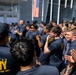 Sailors from USS Howard (DDG 83) participate in a tug-of-war competition during the 87th annual Black Ship Festival in Shimoda, Japan