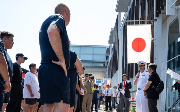 Sailors from USS Howard (DDG 83) participate in a tug-of-war competition during the 87th annual Black Ship Festival in Shimoda, Japan