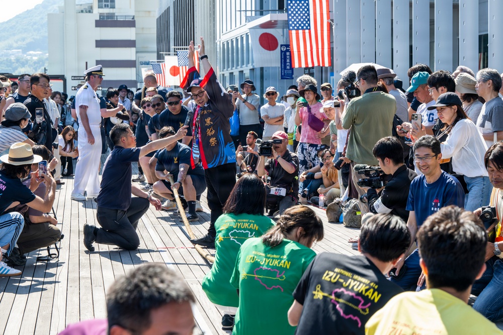 Sailors from USS Howard (DDG 83) participate in a tug-of-war competition during the 87th annual Black Ship Festival in Shimoda, Japan