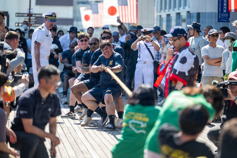 Sailors from USS Howard (DDG 83) participate in a tug-of-war competition during the 87th annual Black Ship Festival in Shimoda, Japan