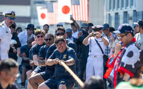 Sailors from USS Howard (DDG 83) participate in a tug-of-war competition during the 87th annual Black Ship Festival in Shimoda, Japan