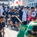 Sailors from USS Howard (DDG 83) participate in a tug-of-war competition during the 87th annual Black Ship Festival in Shimoda, Japan