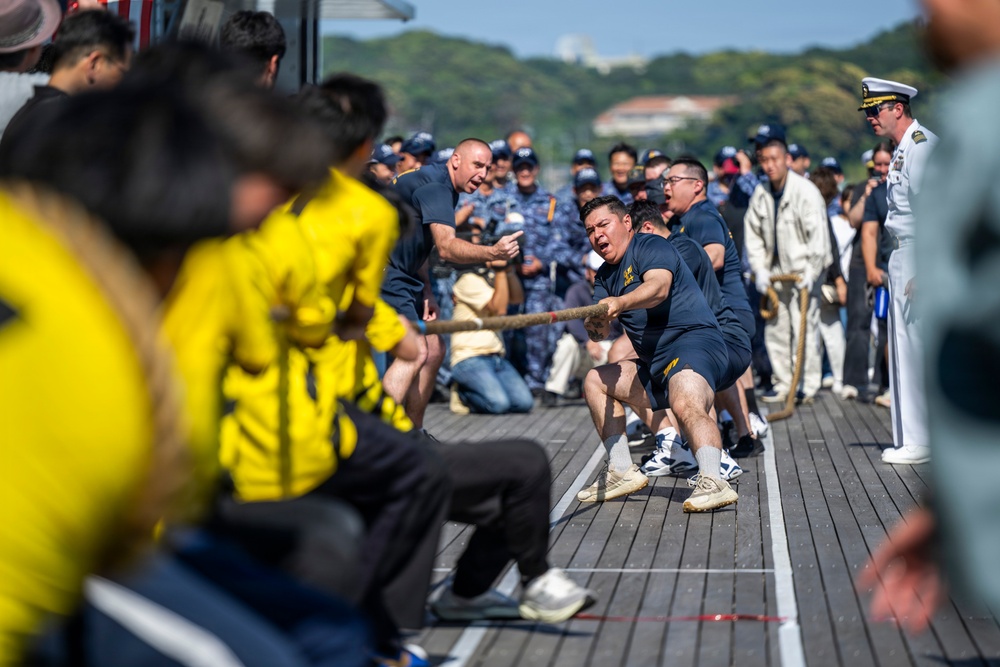Sailors from USS Howard (DDG 83) participate in a tug-of-war competition during the 87th annual Black Ship Festival in Shimoda, Japan