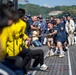 Sailors from USS Howard (DDG 83) participate in a tug-of-war competition during the 87th annual Black Ship Festival in Shimoda, Japan