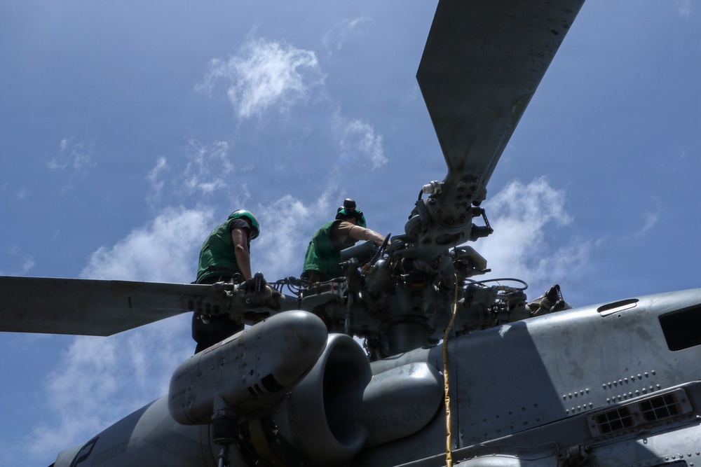 USS Frank E. Petersen Jr. Sailor Conducts Maintenance