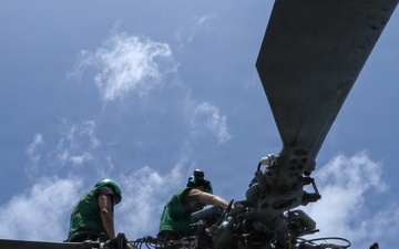 USS Frank E. Petersen Jr. Sailor Conducts Maintenance