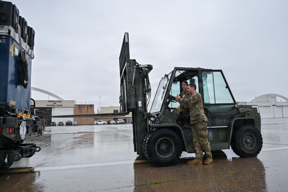 Pennsylvania Air National Guard members unload Blue Angles cargo for the Air Dot Show