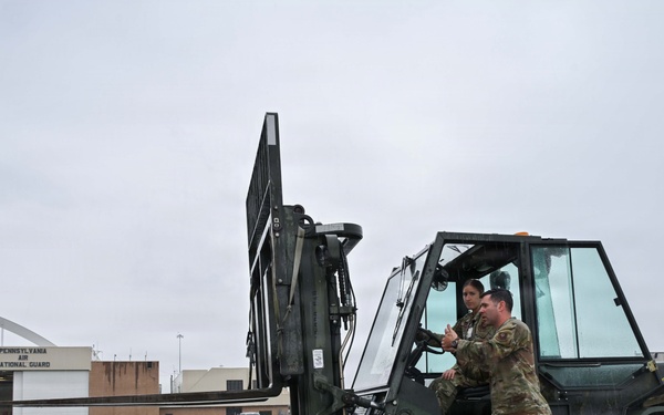 Pennsylvania Air National Guard members unload Blue Angles cargo for the Air Dot Show