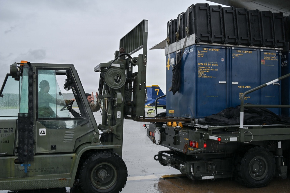 Pennsylvania Air National Guard members unload Blue Angels cargo for Air Dot Show